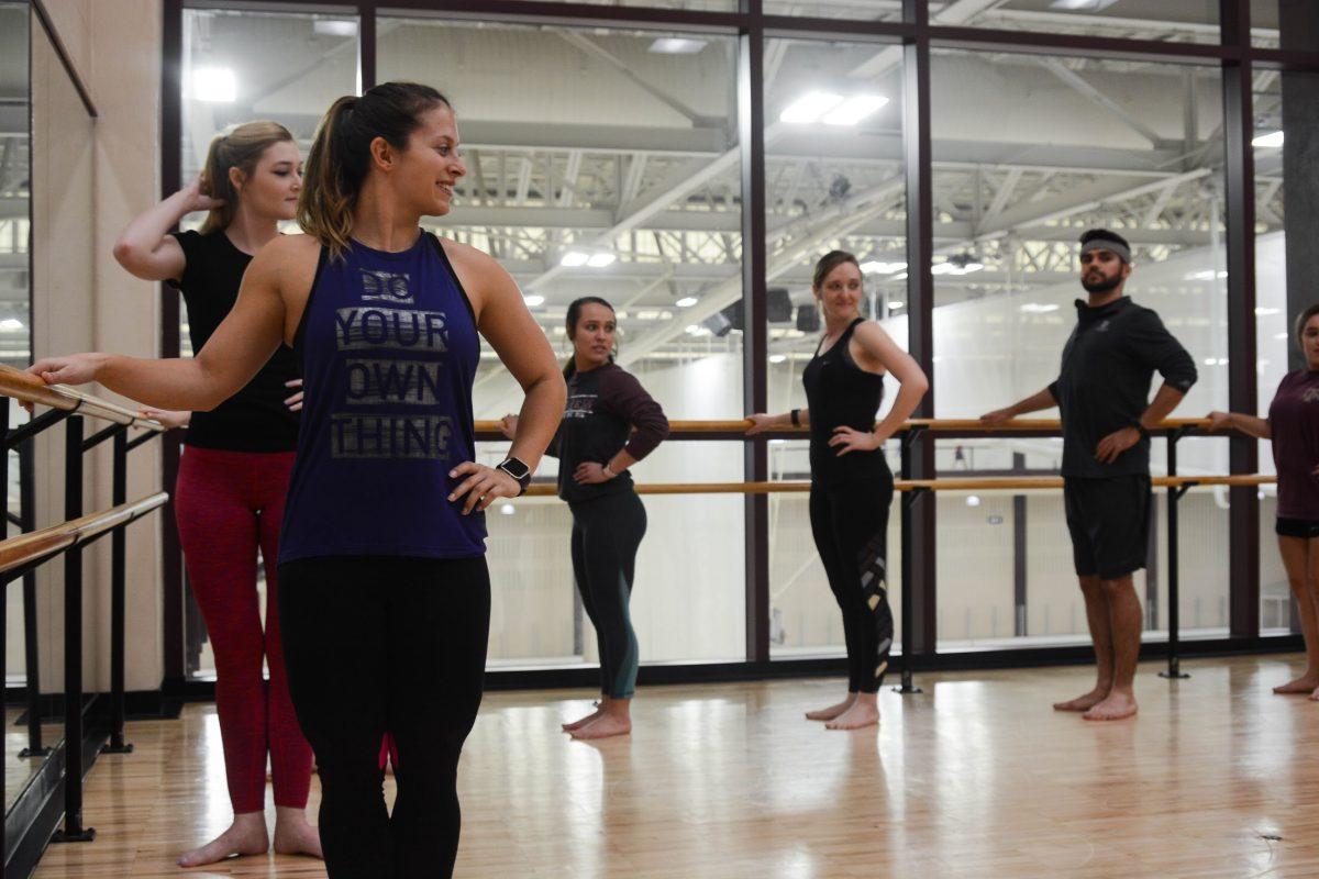 Fitness and wellness coordinator Miranda Price leads a class at the Rec Center. The Rec offers hundreds of classes, ranging from ballet and barre to kickboxing and bootcamp.