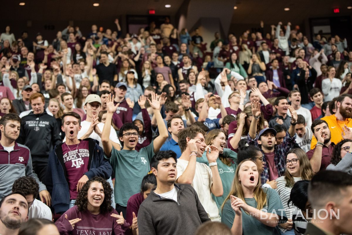 Aggies participate in a yell before tip-off.