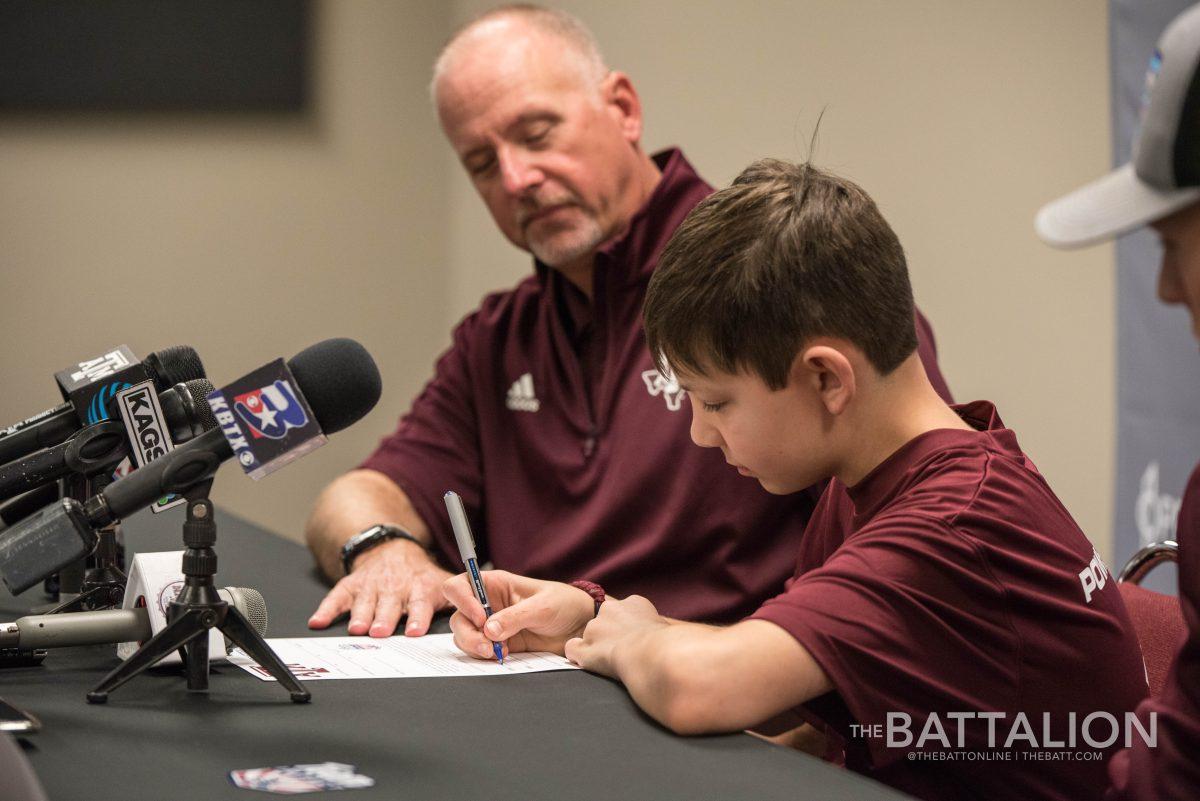 Gus Kimbrough signs a letter of intent with Texas A&M baseball with head coach Rob Childress.