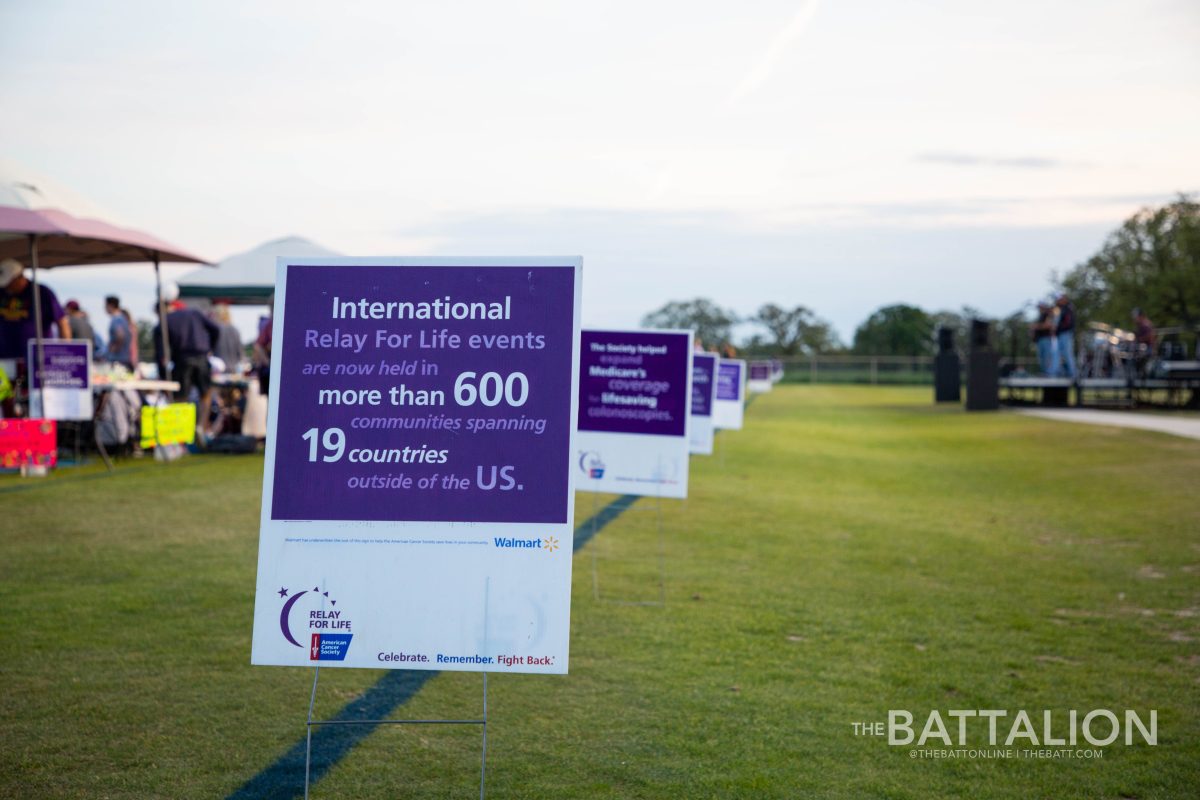 Signs with information about the American Cancer Society lined the track. 