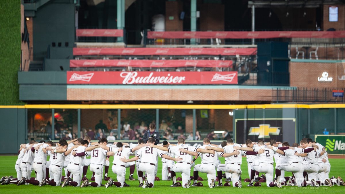 The Aggies circle up together in a pre-game ritual.&#160;