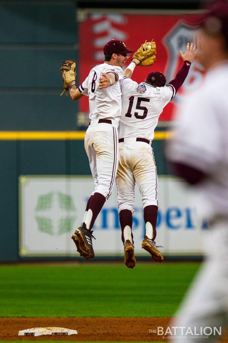 Juniors Braden Shewmake and Bryce Blaum celebrate after Blaum caught the last out to win the game.