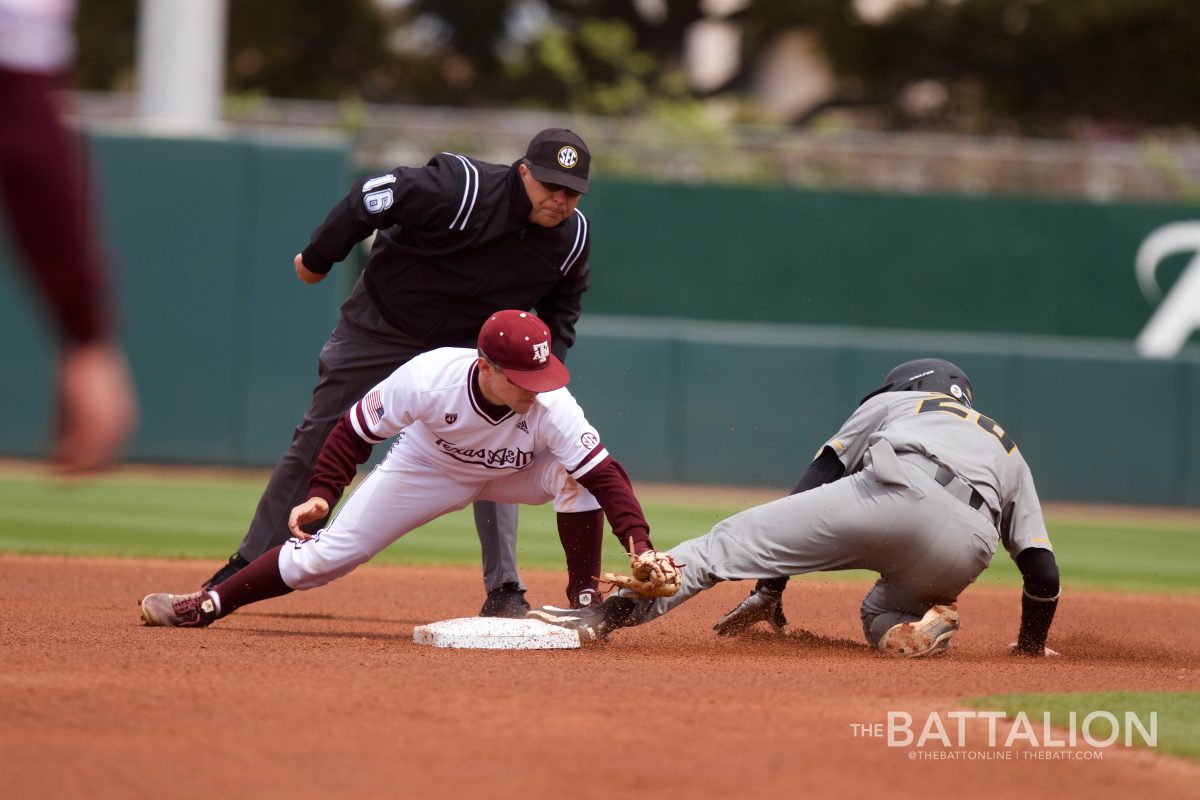 Second baseman Ty Coleman receives a throw from catcher Aaron Walters,&#160;with Missouri runner reaching base safely.&#160;