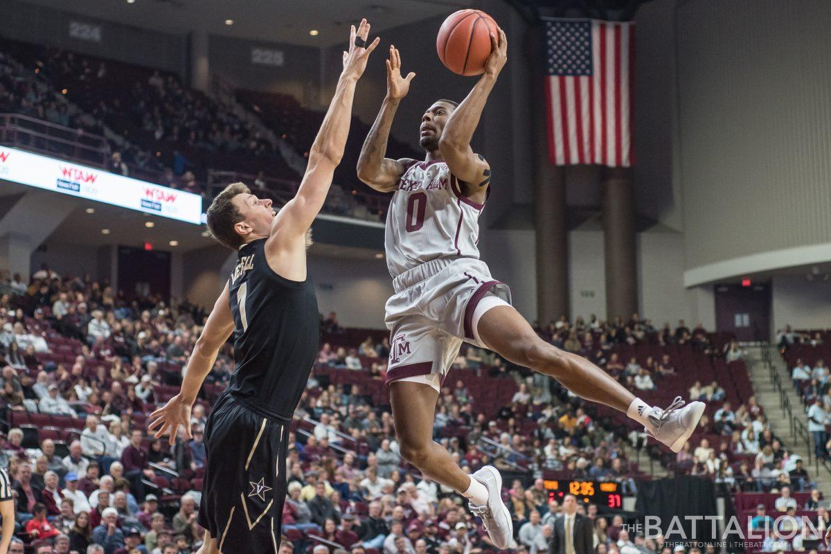 Sophomore guard Jay Jay Chandler scores for the Aggies.