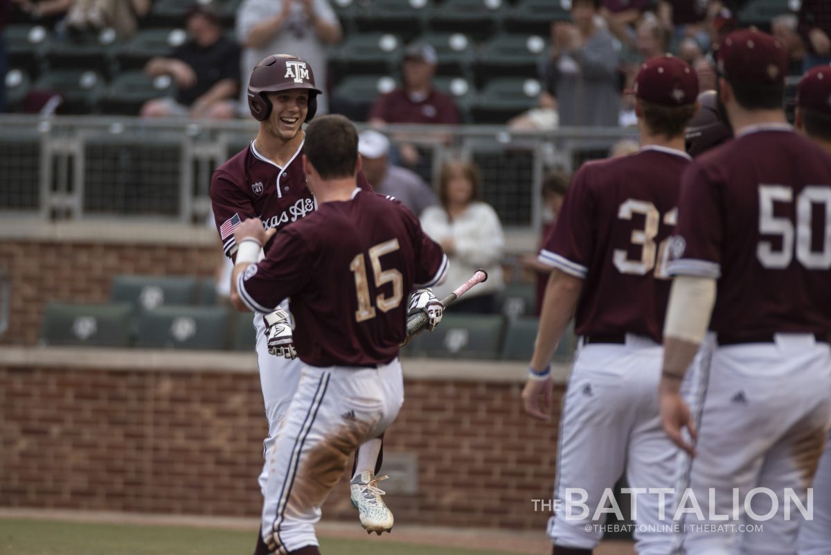 Sophomore outfielder Zach DeLoach and junior infielder Bryce Blaum celebrate during A&M’s 10-5 win over the University of Texas at Arlington.