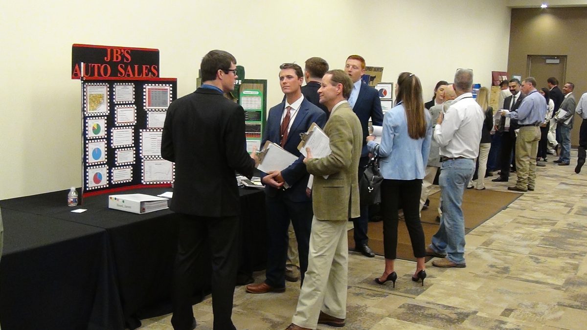 Agriculture Economics students present their projects to business experts at annual symposium, Tuesday.