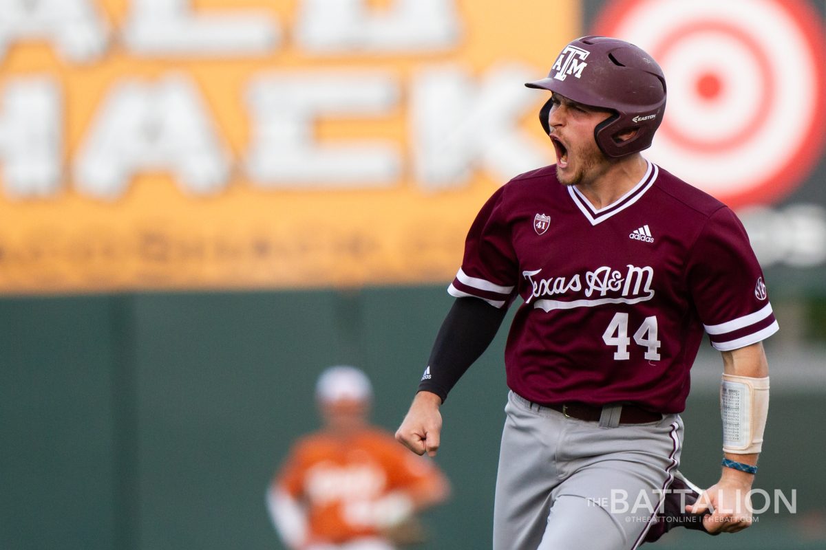 Junior Mikey Hoehner shouts as he rounds second base after hitting a home run during the game against the University of Texas on April 2 at Disch-Falk Field in Austin.