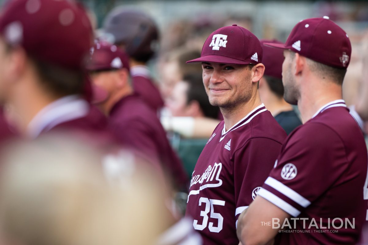 Sophomore Asa Lacy laughs with his teammates during the game against Missouri on March 29 at Olsen Field.