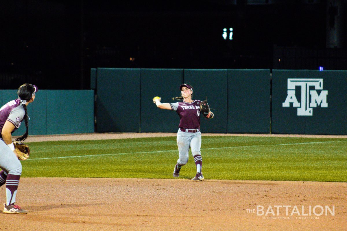 Senior&#160;Riley Sartain gets the runner out after fielding the ball deep in the hole.