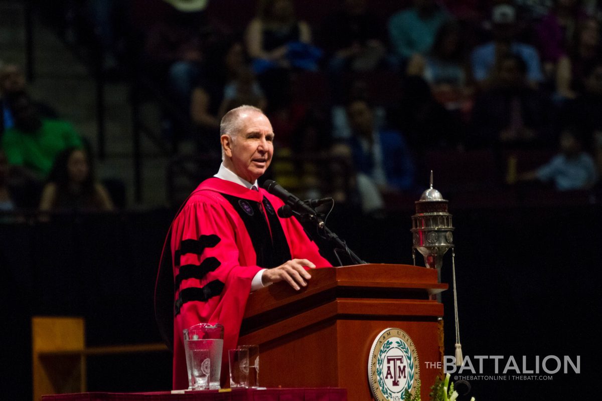 University President Michael K. Young addresses students at a graduation ceremony in 2018. 