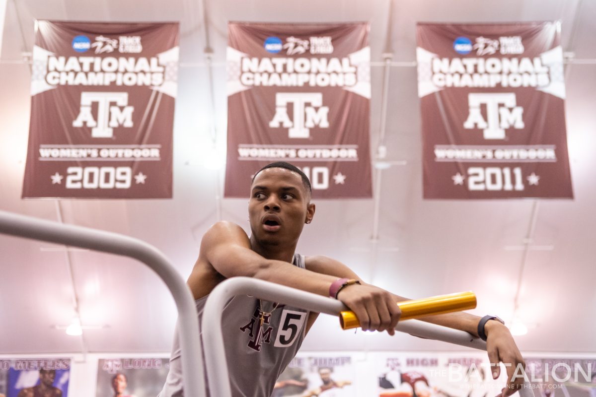 Junior Devin Dixon catches his breath after running the anchor leg and winning the 4x400 relay for Texas A&M.