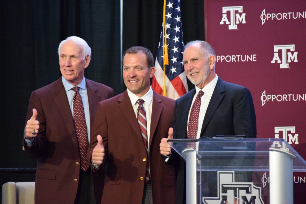 New athletic director, Ross Bjork stands along side President Michael K. Young and Interim athletic director RC Slocum&#160;after his public introduction.