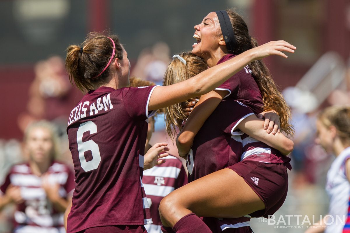 Ally Watt&#160;celebrates with teammates at the Aggies' win over Kansas on Sept. 16.