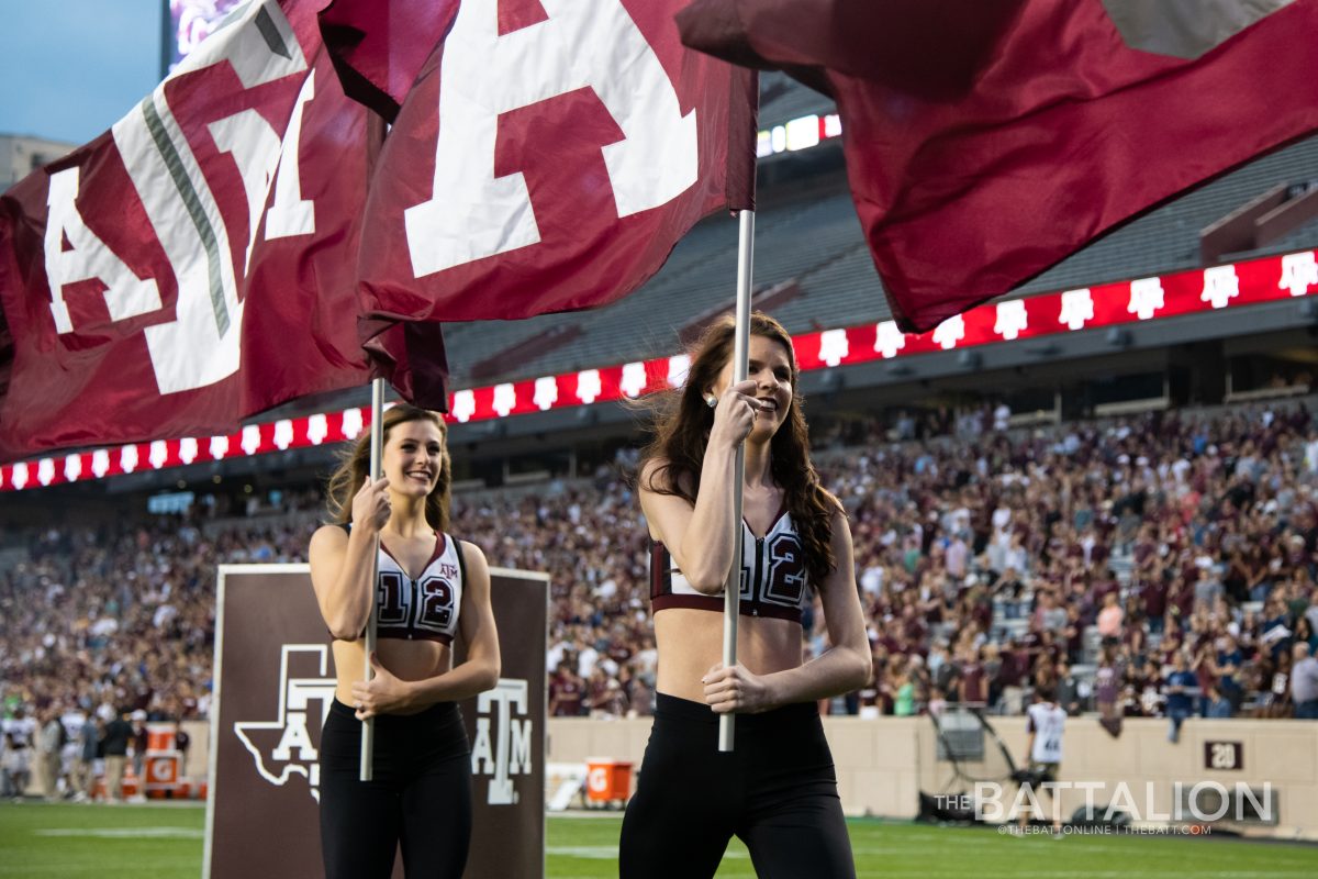 Members+of+the+Aggie+dance+team+carry+flags+off+of+the+field+before+the+Maroon+and+White+football+game+on+April+12+at+Kyle+Field.