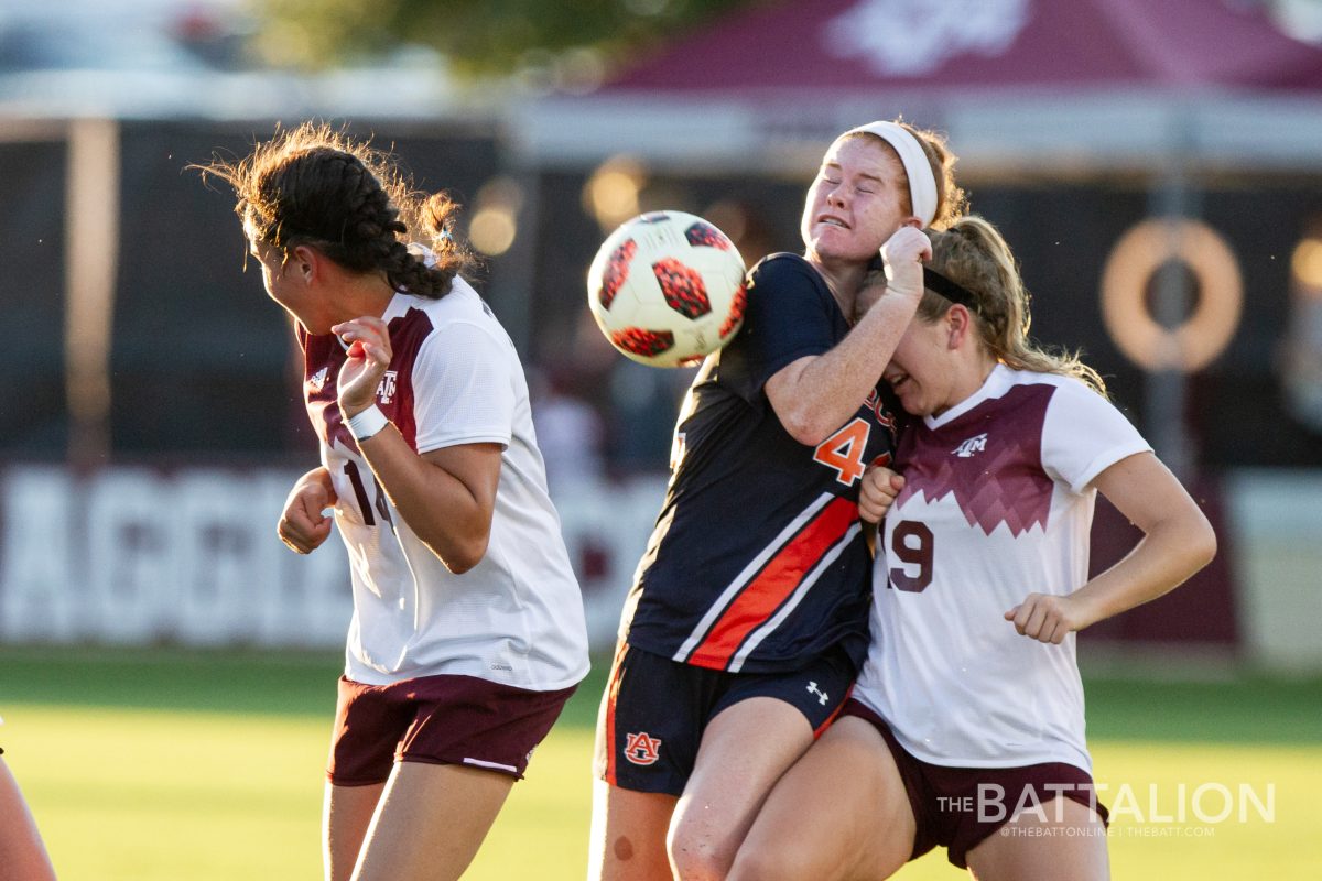 (Left to right) Sophomore defender Jimena Lopez, Auburns Bri Folds and freshman midfielder Kendall Bates fight for control of the ball. A&M emerged victorious with a 4-2 win over Auburn on Oct. 4.