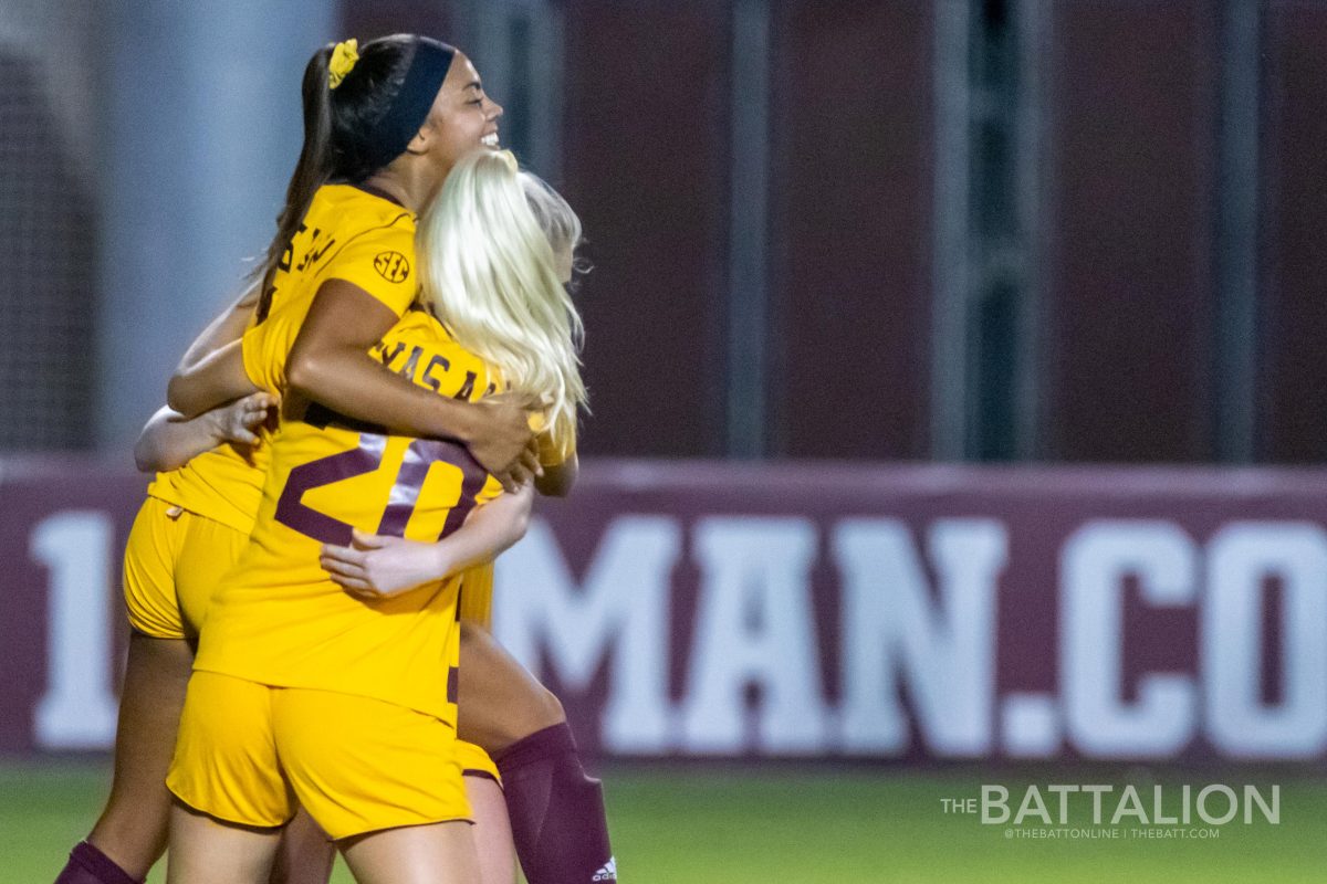 Senior Ally Watt is congratulated by her teammates after one of two goals.