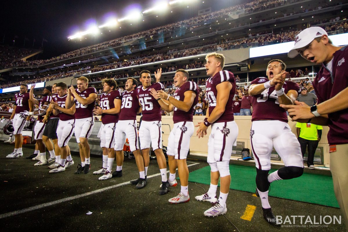 Members of the Aggie football team Whoop after singing the Aggie War Hymn.