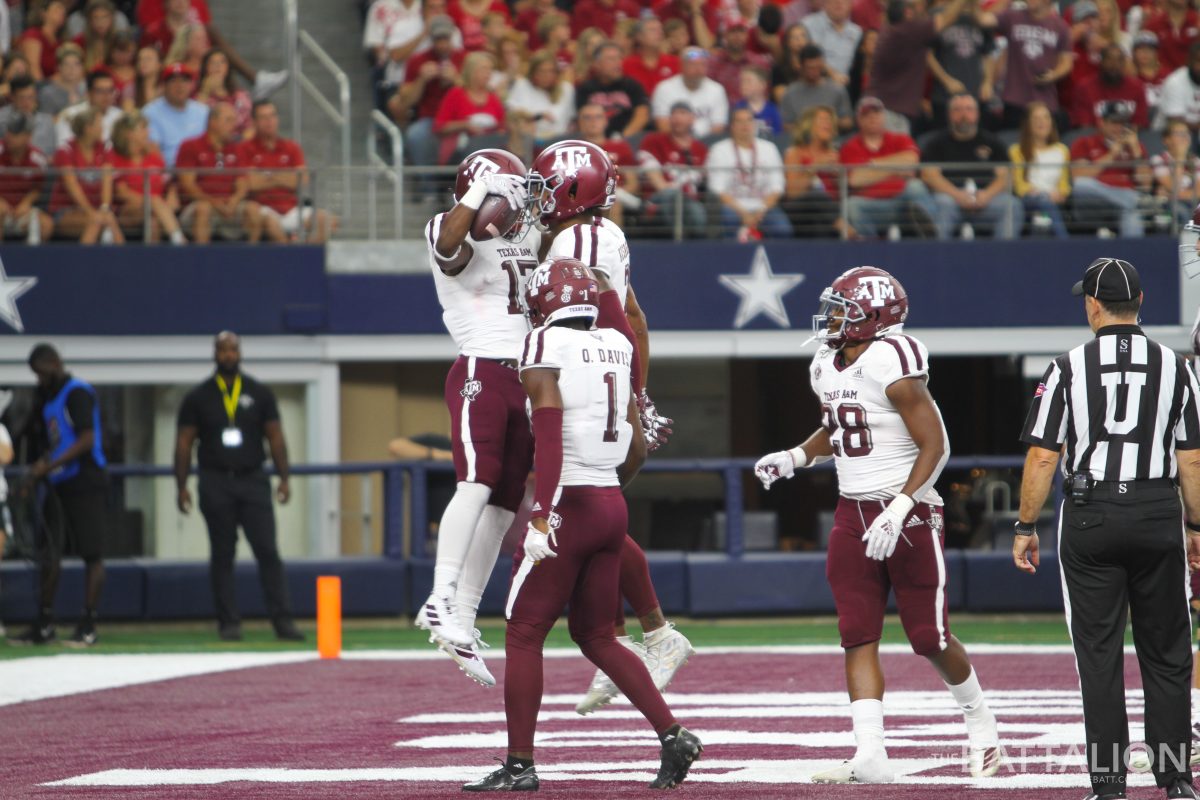Ainias+Smith%26%23160%3Bcelebrates+with+his+fellow+players+after+completing+the+first+touchdown+of+the+game+for+the+Aggies.%26%23160%3B%26%23160%3B