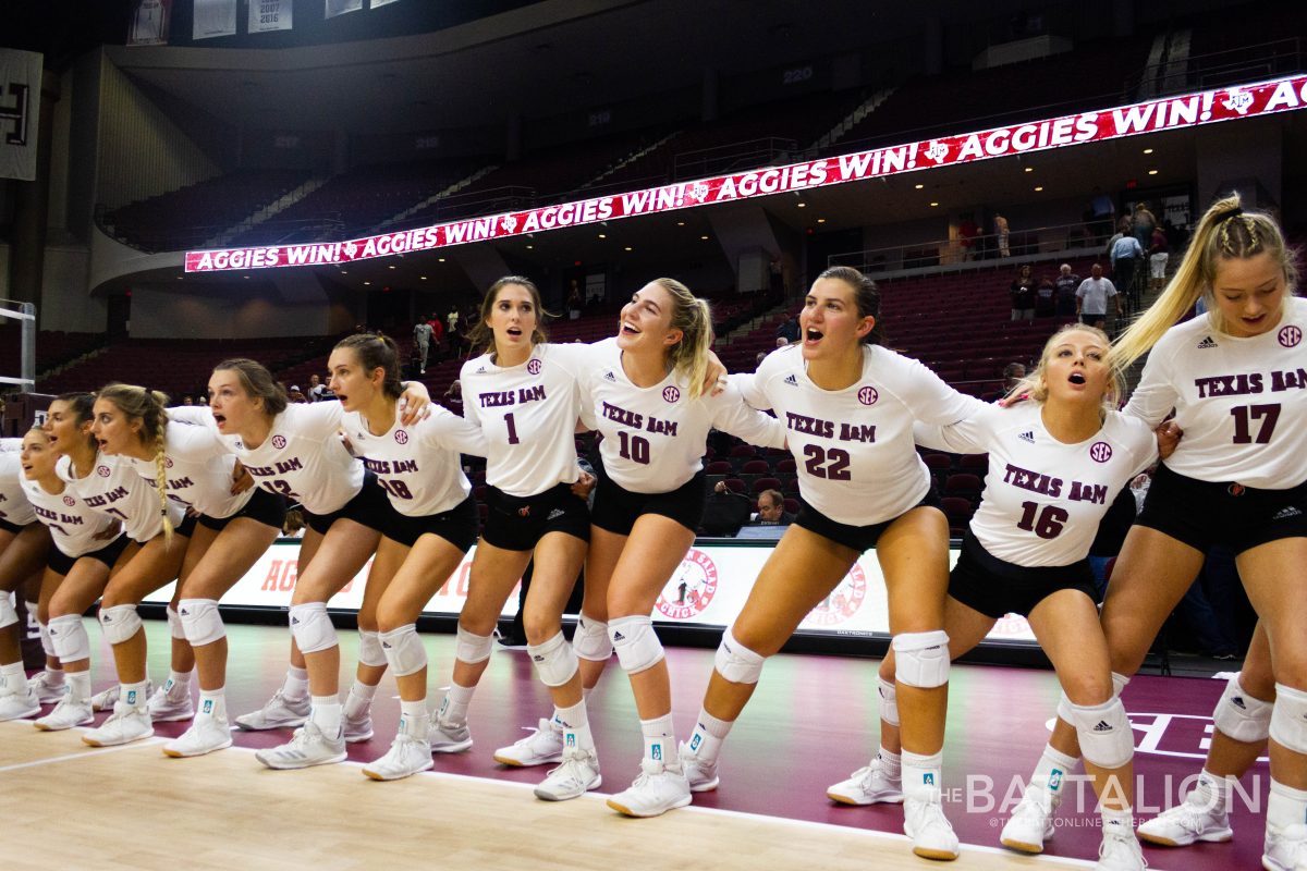 The+Aggie+team+celebrates+a+win+over+Texas+State+by+singing+the+Aggie+War+Hymn.