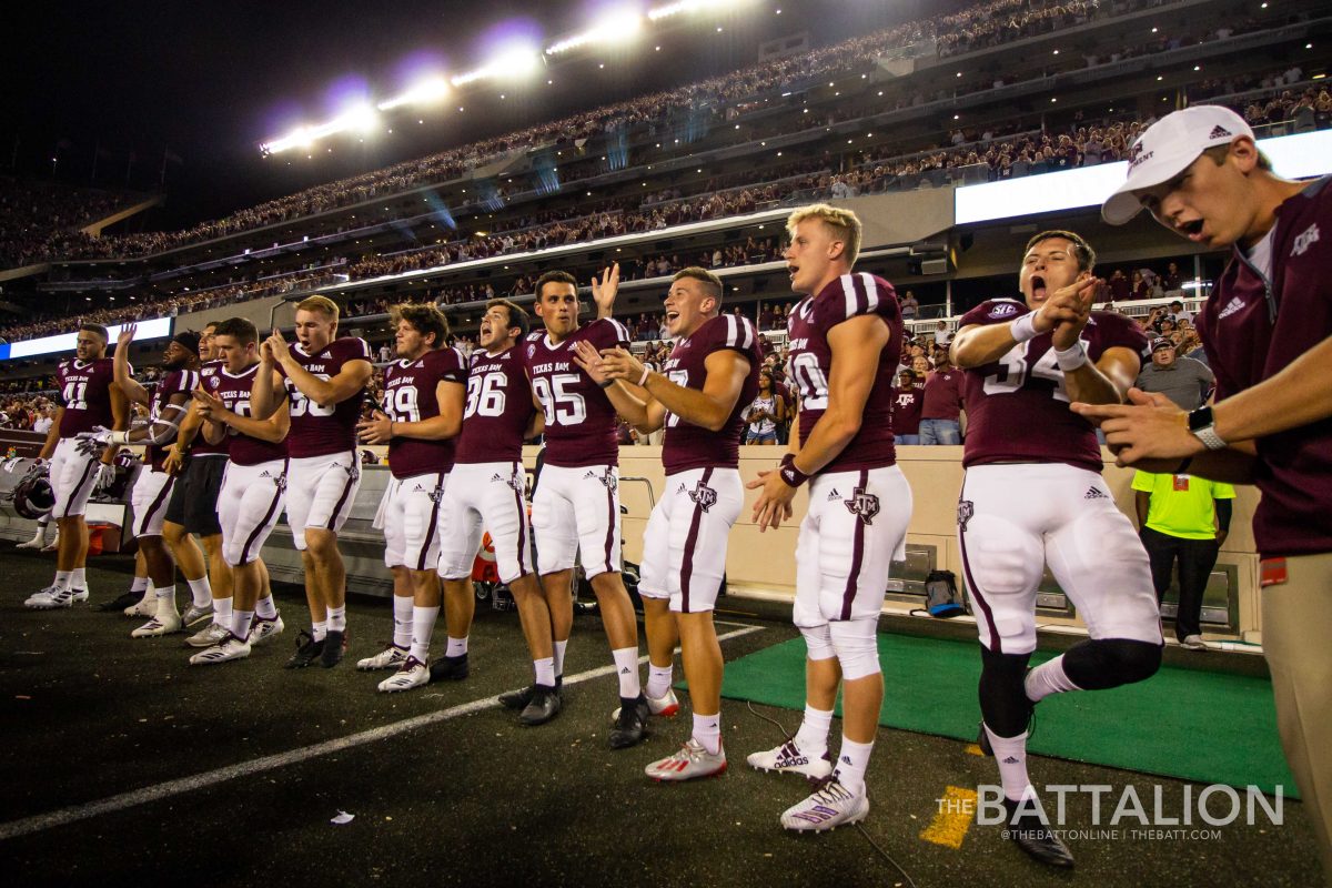 Members of Texas A&M’s special teams whoop after singing The Aggie War Hymn in Kyle Field after a win over Lamar.