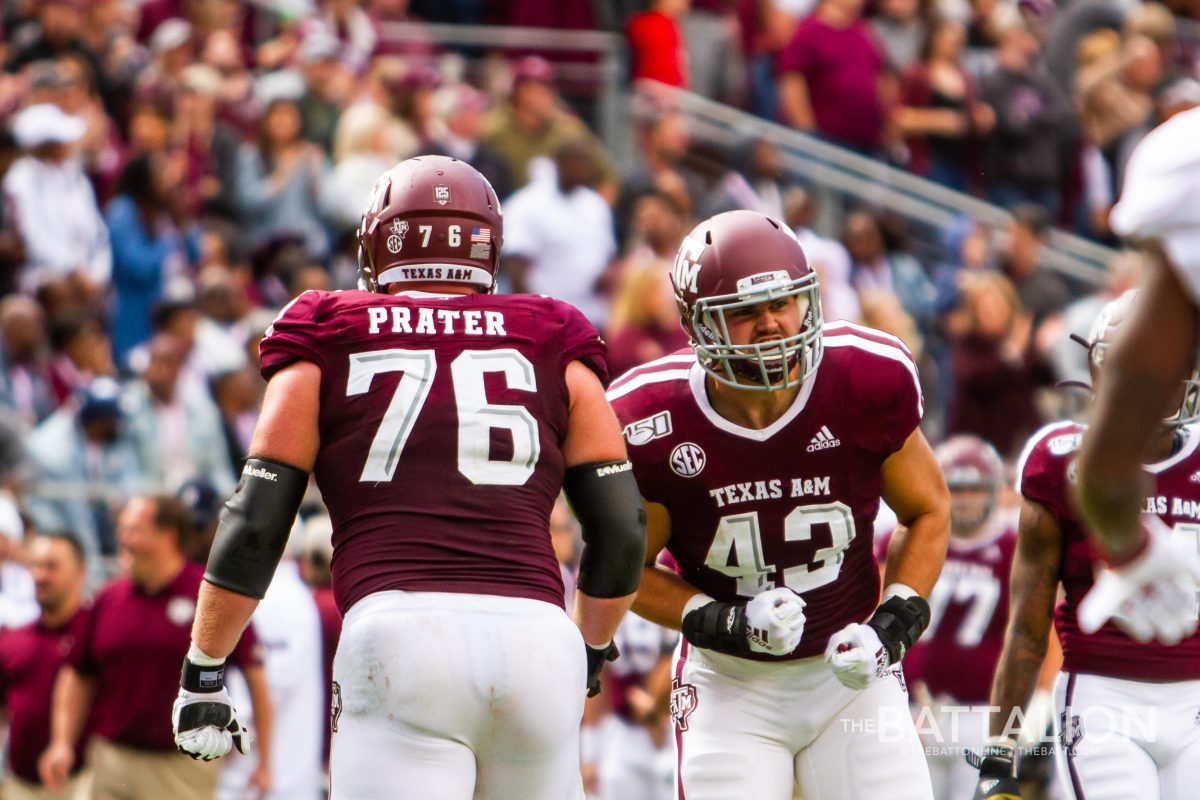 Senior offensive lineman Colton Prater and junior fullback Cagan Baldree celebrate after an A&amp;M touchdown.