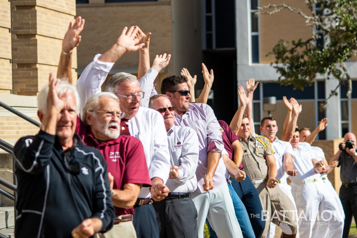 Current and former Yell Leaders hold Yell Practice on the steps of Cushing to celebrate new exhibit.&#160;