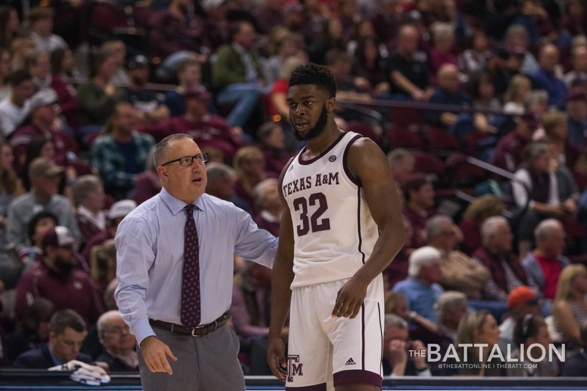 Coach Buzz Williams and Josh Nebo take a moment to have a conversation before play begins again. 