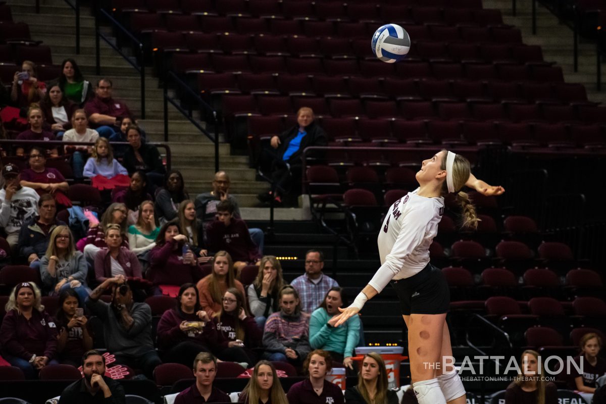 Senior&#160;Hollann Hans&#160;serves the ball.