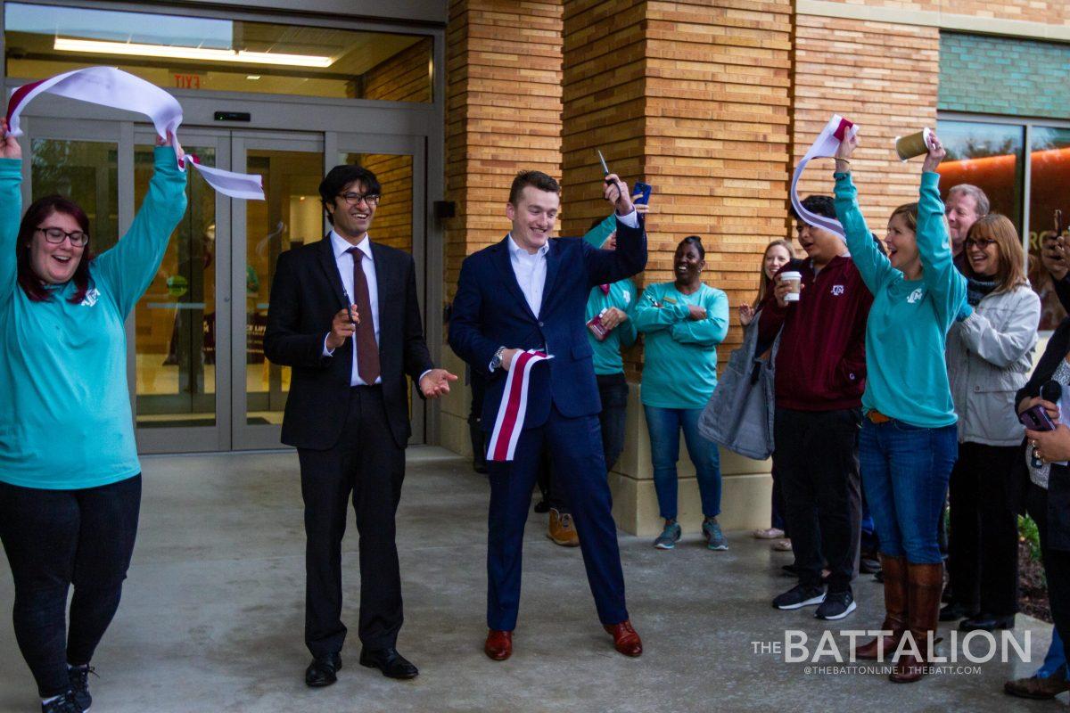Graduate Student Body President Purna Charna Doddapaneni and Student Body President Mikey Jaillet cut the ribbon officially opening the new Student Services Building.