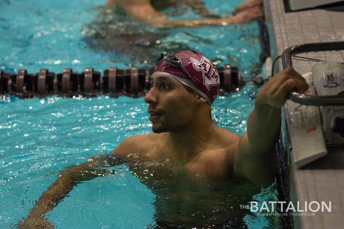 Mike Thibert looks to see how well he swam in the Men 50 Yard Free Style race. 