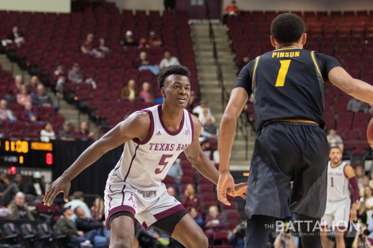 Freshman Emanuel Miller guards a Missouri point guard while the Aggies applied a full court press.