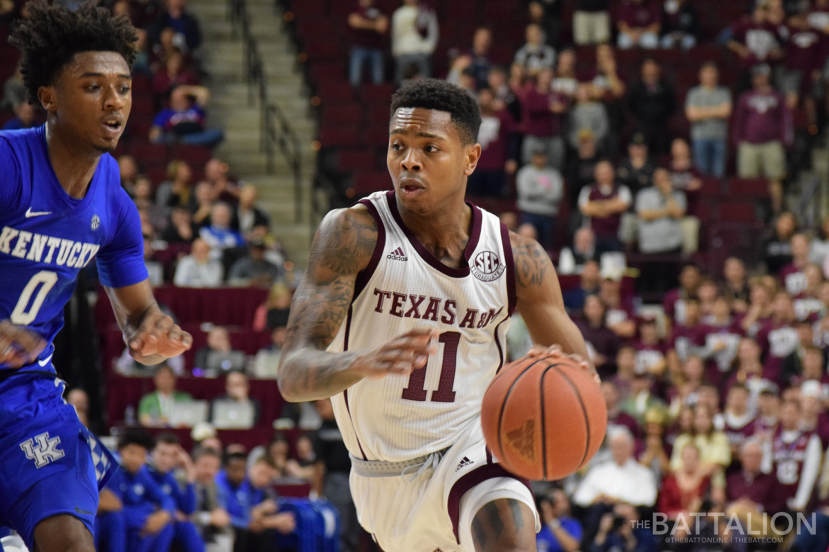 Senior Wendell Mitchell drives past his Kentucky opponent.