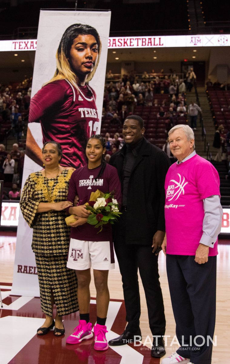 Cheah Rael-Whitsitt celebrates senior day with her family and Coach Gary Blair. 