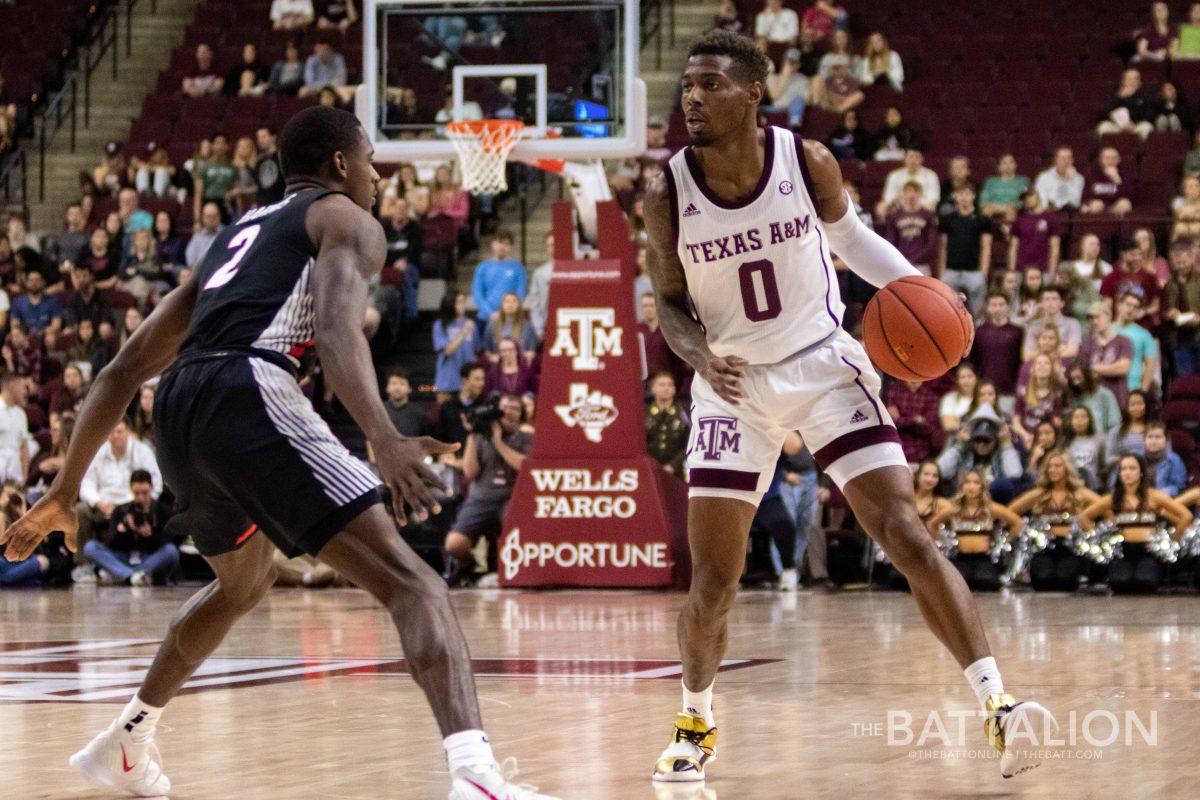 Junior&#160;Jay Jay Chandler&#160;slows down to weigh his options after taking the ball across the court.