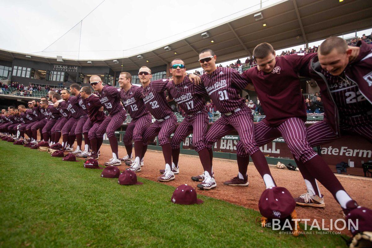 The Aggie baseball team sings the Aggie War Hymn before the game.