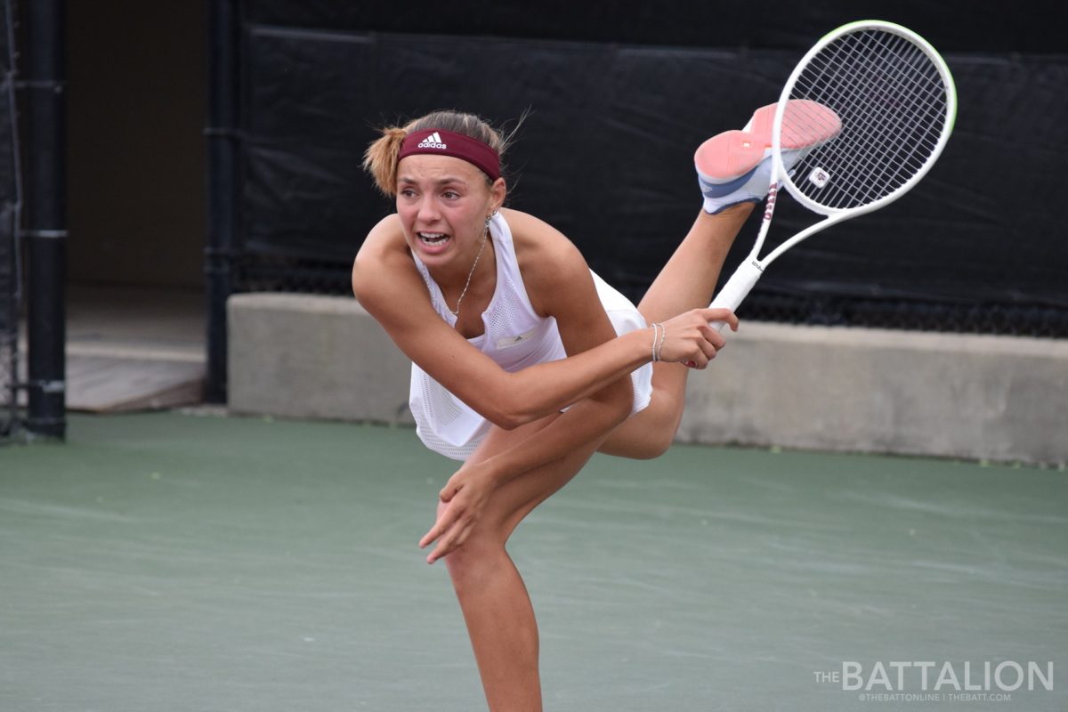 Junior Tatiana Makarova follows through on her serve.