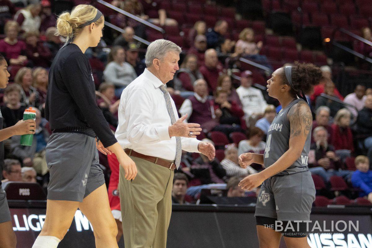 Coach&#160;Gary Blair talked to&#160;Shambria Washington&#160;as a timeout is called.