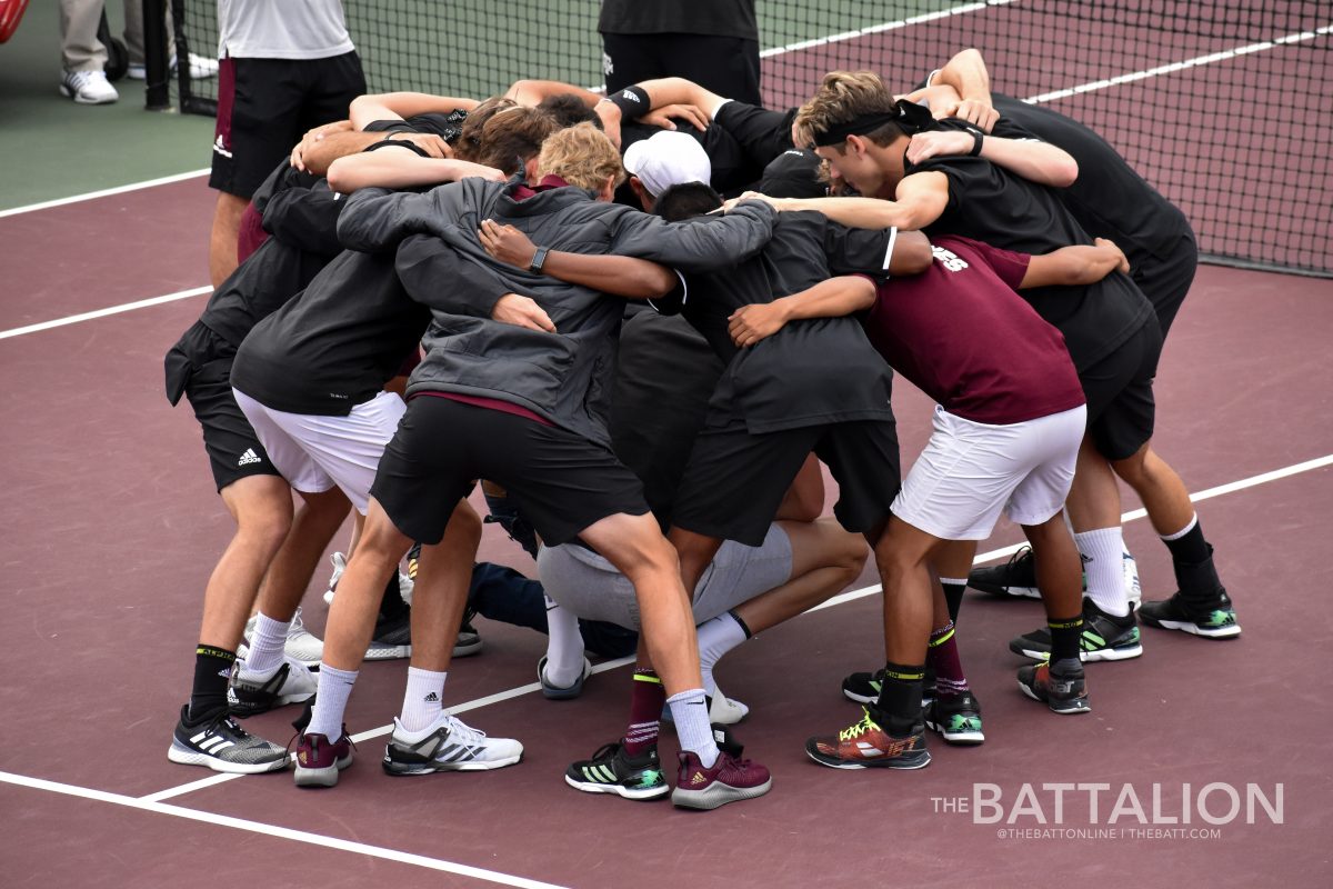 The+Aggies+huddle+together+before+the+matches+begin.