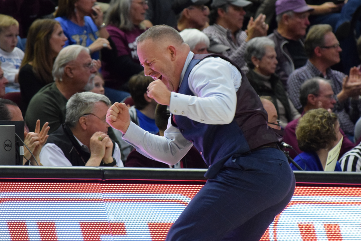 Coach Buzz Williams celebrates after a strong defensive stop.