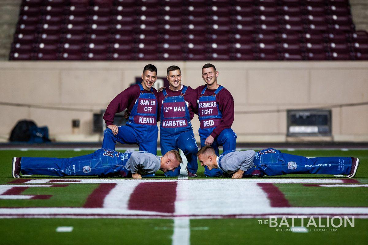 Yell leaders Kenny Cantrell, Karsten Lowe, Reid Williams, Jacob Huffman and Keller Cox wait for midnight in the middle of Kyle Field.