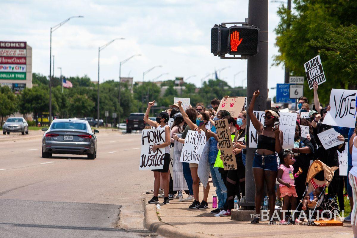 A+crowd+of+around+200+peaceful+protestors+returned+to+the+intersection+of+George+Bush+Drive+and+Texas+Ave.+for+the+second+day+in+a+row+of+protesting+the+fatal+arrest+of+George+Floyd.
