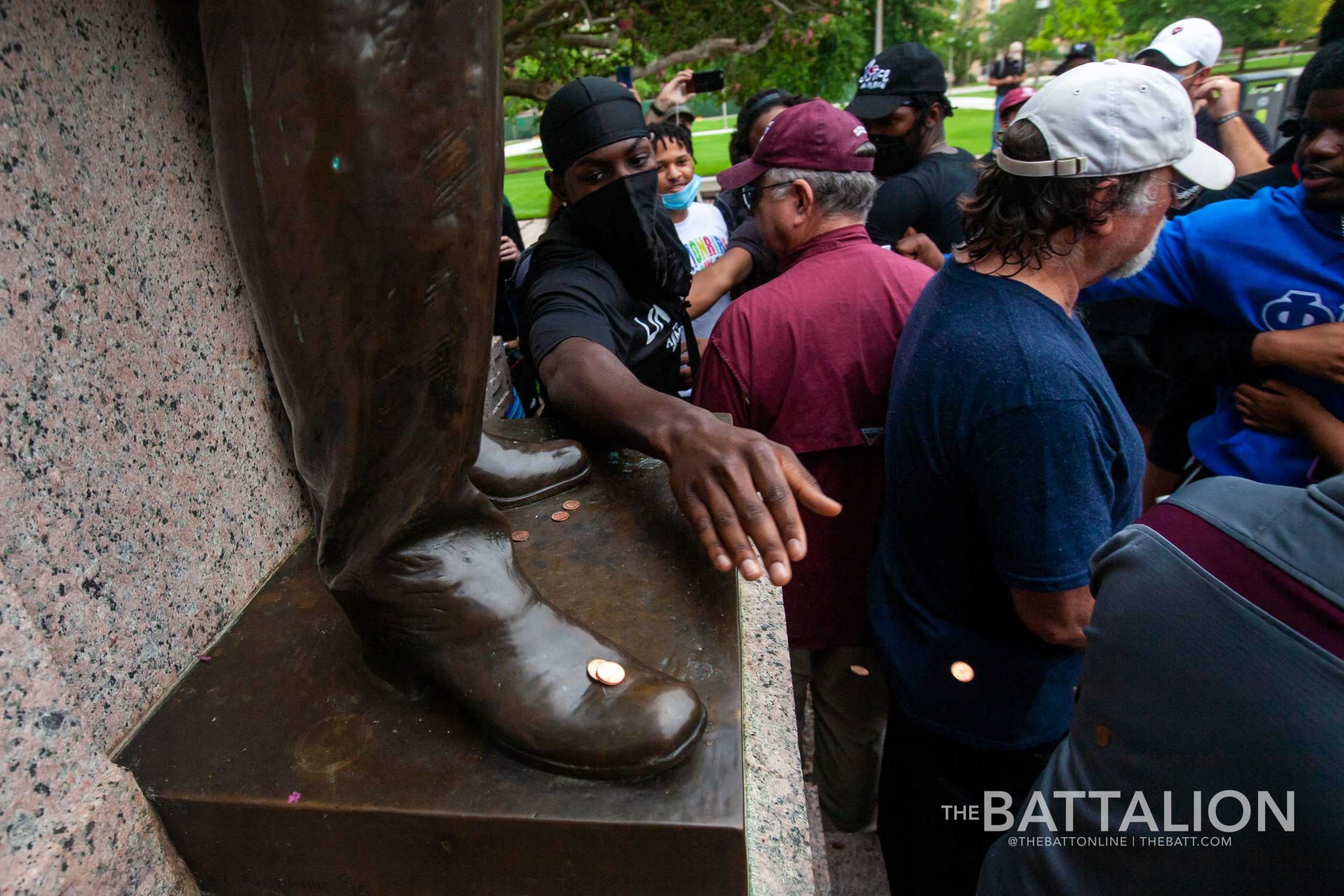 Dozens gather on campus to protest racial injustice, demand action