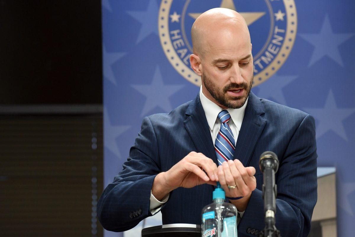 Brazos County Alternate Health Authority Dr. Seth Sullivan applies hand sanitizer while speaking at press conference at the Brazos County Health District on Monday, June 1, 2020.