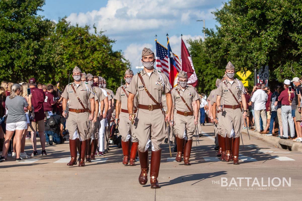 Corps Commander Tanner Cedrone leads the Corps of Cadets in a march-in around campus.