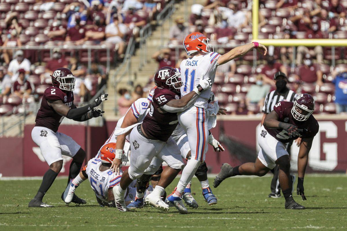 Freshman defensive lineman McKinnley Jackson tackles Florida quarterback Kyle Trask.