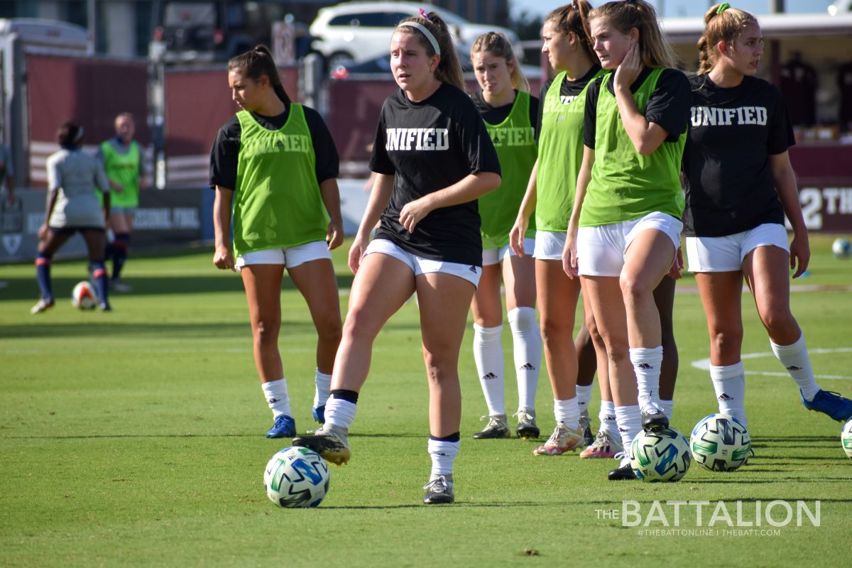 Sophomore midfielder Kendall Bates prepares for the game by doing some drills with her teammates. 