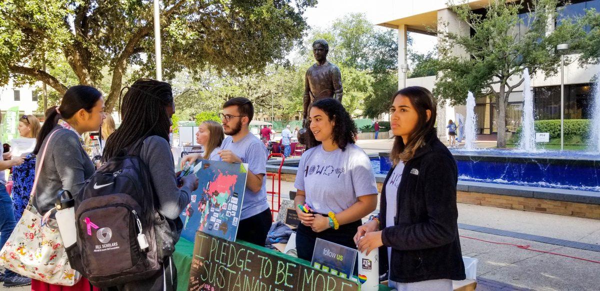 Interns run a table in fall 2019 for the Office of Sustainability.