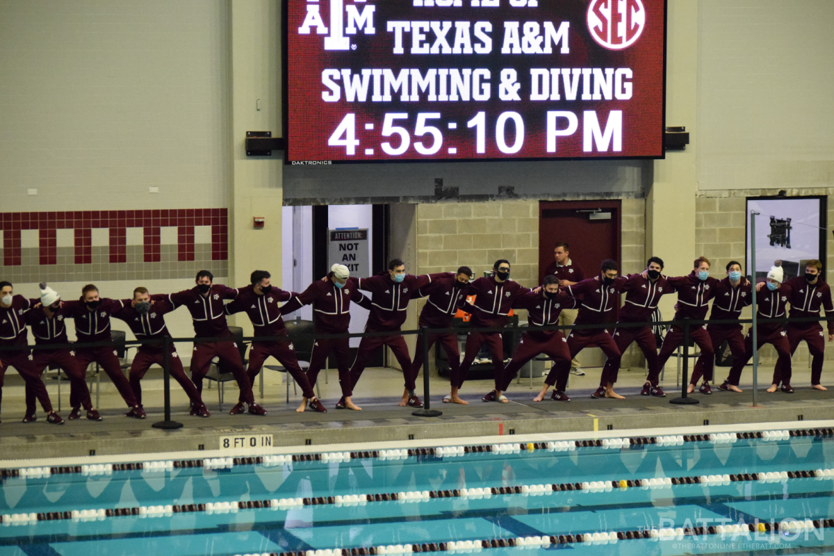 The Texas A&amp;M Men's Swimming and Diving team cheer each other on before the meet starts.