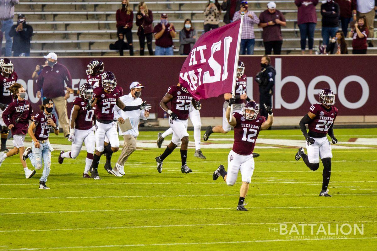 Graduate student linebacker and 12th Man Braden White leads the Aggies onto the field