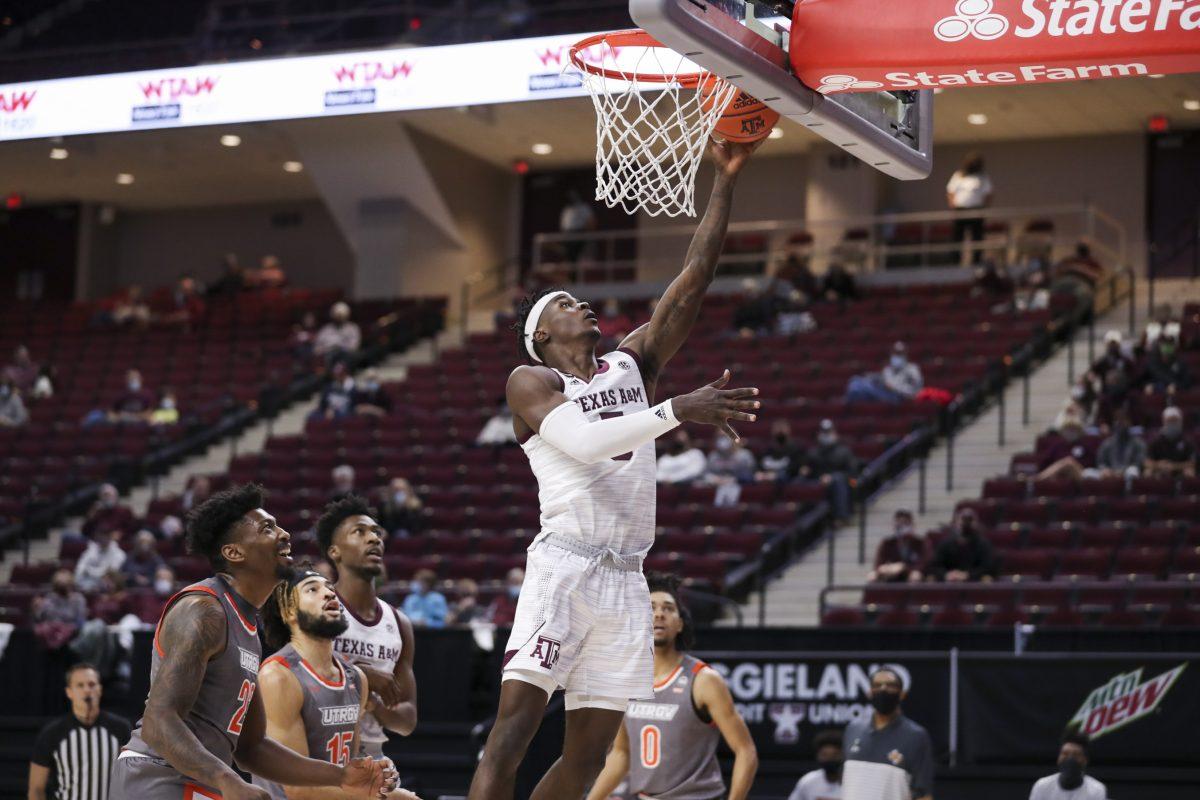 Sophomore forward Emanuel Miller drives to the basket for a layup.